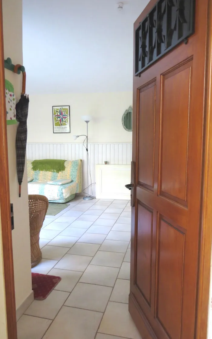 The studio's independent front door opening onto the living area
